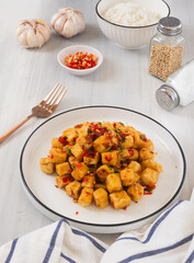 Tahu Cabe Garam or Salt and Pepper Tofu, Crispy Cubed Deep Fried Tofu with Garlic and Chilli Flakes. Perfect for recipe, article, or any cooking contents.