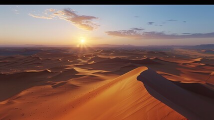 A vast desert landscape with rolling sand dunes and a setting sun casting long shadows.