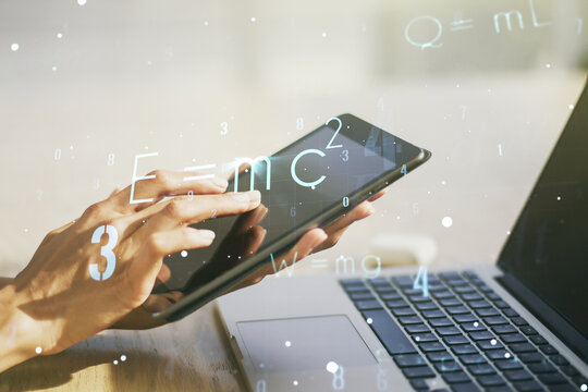 Creative scientific formula illustration with finger presses on a digital tablet on background, science and research concept. Multiexposure