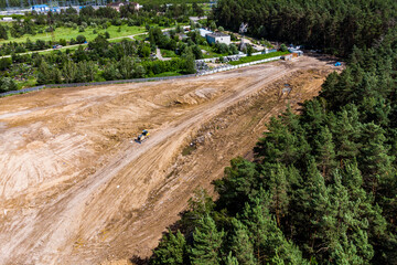 Leveling an industrial area with a bulldozer, aerial view