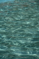 Fototapeta premium Summer background made of clear blue-green water