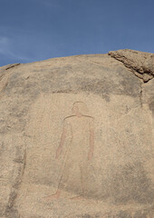 Ancient egyptian carvings and hieroglyphs on granite rocks near Famine Stela in Aswan, Egypt 