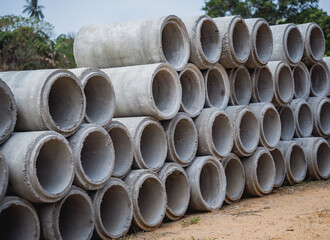 A stack of concrete ring pipes piled and creating a symmetrical arrangement