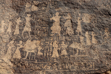 Ancient egyptian carvings and hieroglyphs carved on Famine Stela stones in Aswan, Egypt 