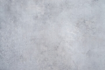 Background texture is a gray bare cement wall.
