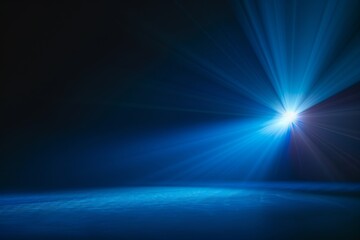 Dark stage with a single bright spotlight