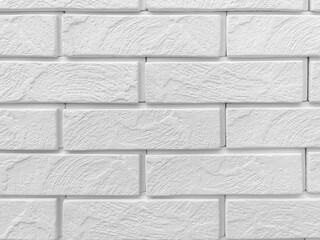 Abstract background of decorative brick wall. Black and white photo. Close-up.