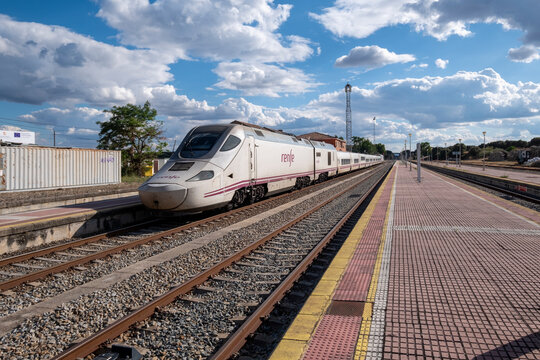 Malpartida de Plasencia, Caceres, Spain - June 20, 2024: A modern train stopped at the old and still functioning Monfrague or Palazuelo Empalme train station.