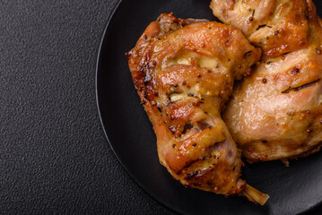 Delicious grilled chicken leg or quarter with salt and spices