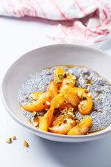 Chia pudding with caramelized apricot, maple syrup and pistachio.