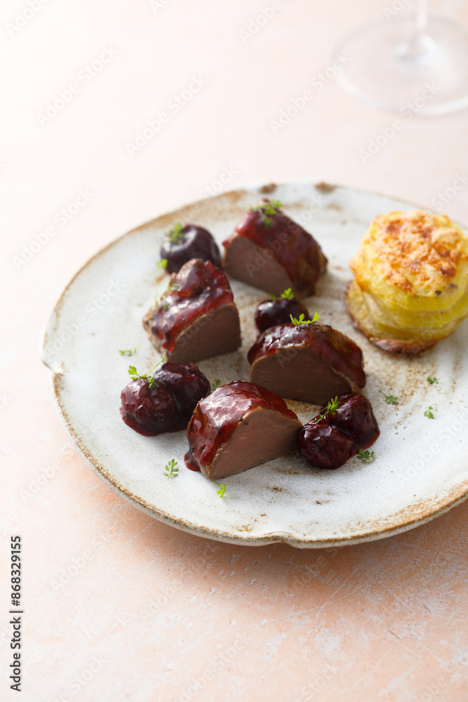 Canvas Prints Roasted venison fillet with hot cherries