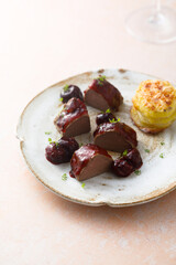 Roasted venison fillet with hot cherries