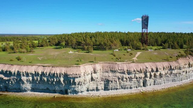 4K panoramic aerial video from flying drone to Panga coastal cliff and lighthouse , northern shore of Saaremaa island, near Kuressaare, Baltic Klint.Saaremaa , Estonia
