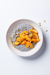Chia pudding with caramelized apricot, maple syrup and pistachio.