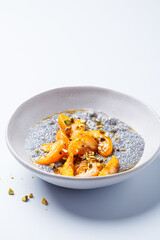 Chia pudding with caramelized apricot, maple syrup and pistachio.