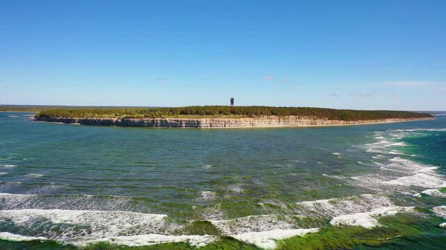 4K panoramic aerial video from flying drone to Panga coastal cliff and lighthouse , northern shore of Saaremaa island, near Kuressaare, Baltic Klint.Saaremaa , Estonia
