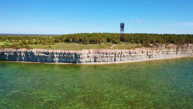 4K panoramic aerial video from flying drone to Panga coastal cliff and lighthouse , northern shore of Saaremaa island, near Kuressaare, Baltic Klint.Saaremaa , Estonia