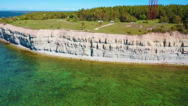 4K panoramic aerial video from flying drone to Panga coastal cliff and lighthouse , northern shore of Saaremaa island, near Kuressaare, Baltic Klint.Saaremaa , Estonia