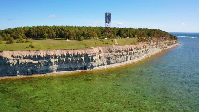 4K panoramic aerial video from flying drone to Panga coastal cliff and lighthouse , northern shore of Saaremaa island, near Kuressaare, Baltic Klint.Saaremaa , Estonia