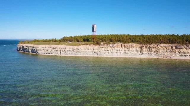 4K panoramic aerial video from flying drone to Panga coastal cliff and lighthouse , northern shore of Saaremaa island, near Kuressaare, Baltic Klint.Saaremaa , Estonia