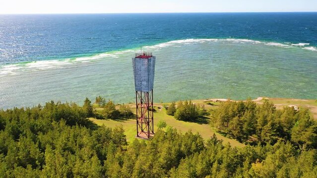 4K panoramic aerial video from flying drone to Panga coastal cliff and lighthouse , northern shore of Saaremaa island, near Kuressaare, Baltic Klint.Saaremaa , Estonia
