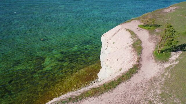4K panoramic aerial video from flying drone to Panga coastal cliff and lighthouse , northern shore of Saaremaa island, near Kuressaare, Baltic Klint.Saaremaa , Estonia