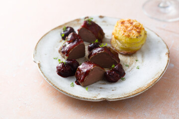 Roasted venison fillet with hot cherries