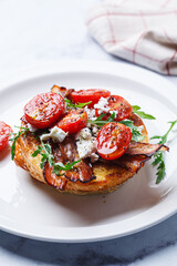 French toast with bacon, tomato, arugula and feta.