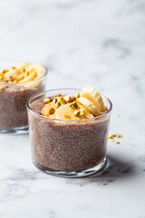 Chocolate chia pudding with banana, pistachio and maple syrup.