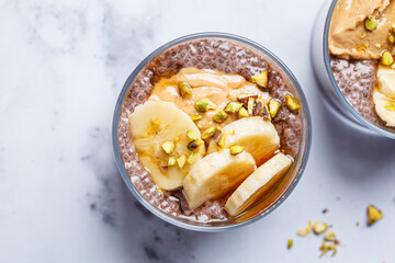 Chocolate chia pudding with banana, pistachio and maple syrup.