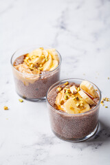 Chocolate chia pudding with banana, pistachio and maple syrup.
