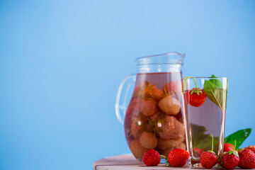 Sweet refreshing berry compote of ripe strawberries in a decanter