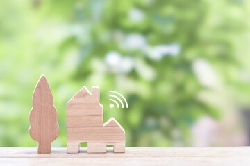 Miniature house with Wifi signal. The concept of network connect, internet of things, smart home control and automation system technology