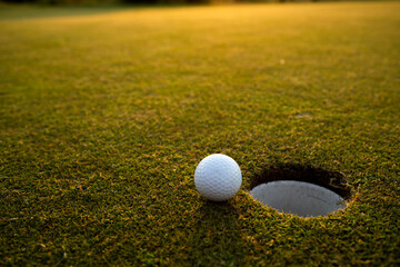 Closeup Golf ball on green grass on course, Sport and lifestyle