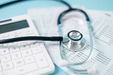 Stethoscope symbolizes essential medical care provided within health care system, health insurance...