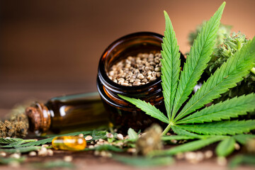Hemp oil and marijuana leaves on extract cbd