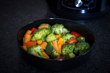 fresh cooking at home - colorful vegetable cooked in a pressure cooker