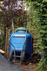 Large blue plastic wheelbarrow, North Yorkshire England
