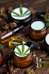 Cbd hemp cosmetics, oil in bottle and marijuana