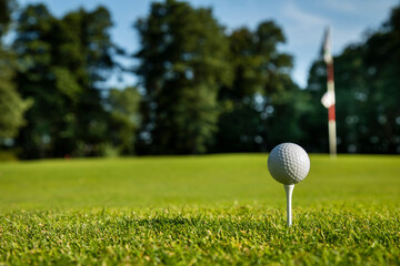Closeup Golf ball on green grass on course