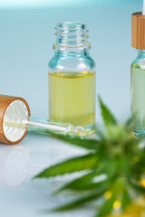 Set of essential oil cbd in a glass bottle, with a pipette, marijuana concept.