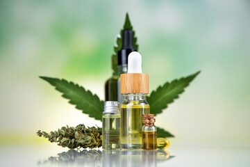 Hemp cbd oil, cannabis leaves, hemp seeds and bottles of oil