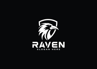 Vector logo of a raven head with a shield isolated on a black background.