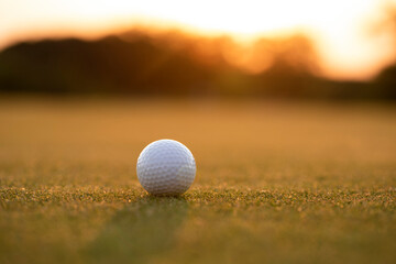 Closeup Golf ball on green grass on course, Sport and lifestyle