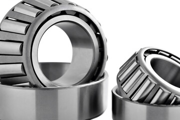 roller bearings on a white background, blank for creativity. Parts for machines and mechanisms in rotation units. Close-up copy space