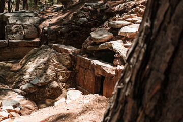 Fototapeta premium Kadianda or cadyanda antique Lycian town ruins in the forest, stairs, buildings, abandones forest paths, Fethiye open air museum