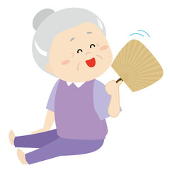 団扇であおいで涼むシニア女性3