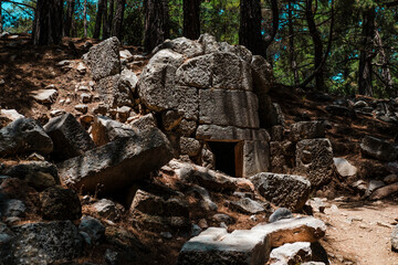 Kadianda or cadyanda antique Lycian town ruins in the forest, stairs, buildings, abandones forest paths, Fethiye open air museum