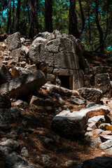 Kadianda or cadyanda antique Lycian town ruins in the forest, stairs, buildings, abandones forest paths, Fethiye open air museum