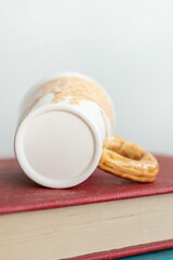 Creative ceramic cup on the books. Concept of education and coffee